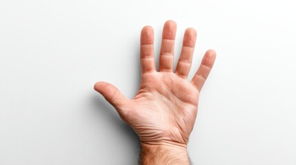 Fototapeta premium An open palm hand is centered against a plain white background, suggesting themes of chaos and freedom of expression. The simplicity of the setup highlights the hand's form and gesture
