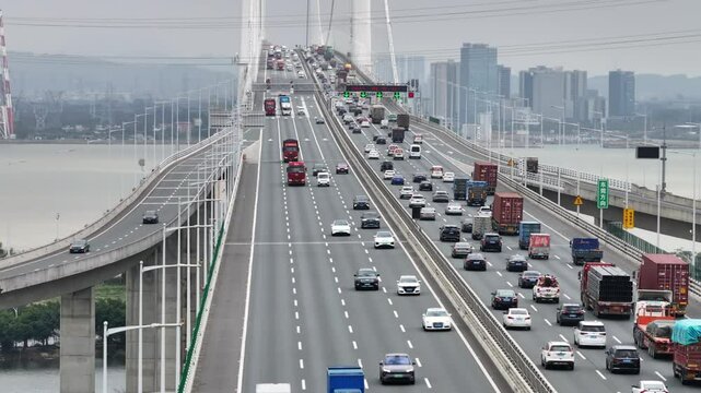 Logistic bridge China. Lot cargo car drive transport road traffic. Chinese aerial top view, fast urban long highway. Modern city, busy auto express way, freight delivery. Asian economy development.