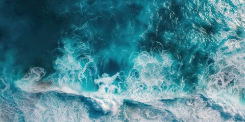 Arial view storm of waves in the deep ocean dark green blue turquoise and white air bubble foam turbulence.