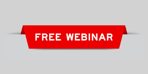Red color inserted label with word free webinar on gray background