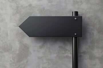 A black directional sign pointing left on a textured wall