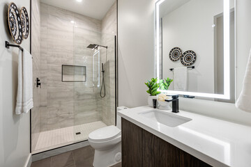 A welldesigned bathroom with a toilet, sink, and shower
