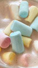 Colorful marshmallows in a mug of hot chocolate