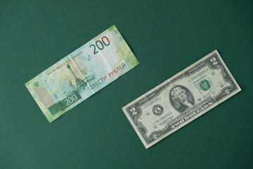 dollar and Russian ruble on a green background