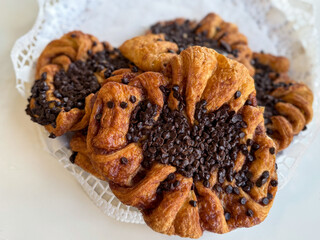 Traditional Hamburg pastry Franzbroetchen made from puff pastry, sugar and cinnamon with chocolate close up