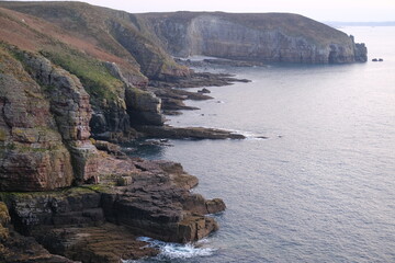 A view of Cape Frehel and its huge cliffs. Plevenon, France - March 25, 2025.