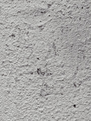 Close-up of a rough white wall texture.
