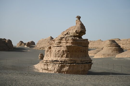Unique desert rock formations under clear sky.