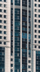 many windows and walls facade of a modern skyscraper without people