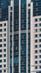 Fototapeta premium many windows and walls facade of a modern skyscraper without people