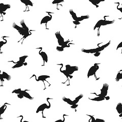 Obraz premium Seamless pattern featuring black silhouettes of herons in various poses