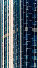 Obraz premium many windows and walls facade of a modern skyscraper without people