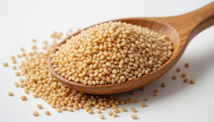 Wooden spoon filled with an abundant amount of buckwheat displayed on a rustic wooden table