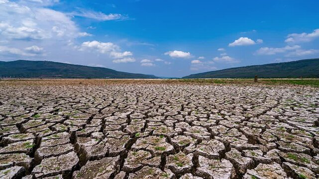 Time Lapse area of cracked soil caused by long draught Dry landscape with crack pattern caused by lack of water.
