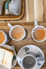 Popular drink in Malaysia called Teh Tarik. It is a sweet drink made from tea with milk. Fractal on the cup is generic print.