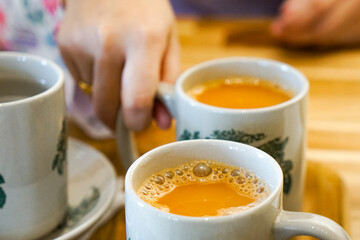 Popular drink in Malaysia called Teh Tarik. It is a sweet drink made from tea with milk. Fractal on...
