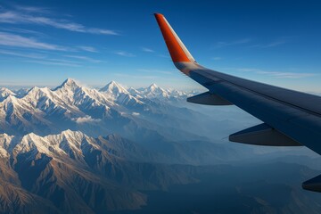 Obraz premium View of Snow-Capped Mountains From Airplane Wing During Flight Over Breathtaking Landscape