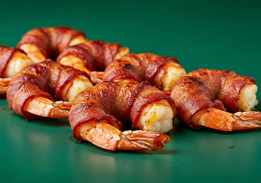 Crispy Bacon Wrapped Shrimp on Green Background