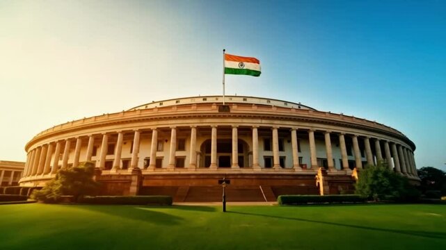 Indian Parliament Building With National Flag During Sunset