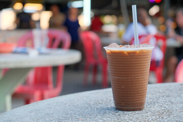 Close up of traditional Malaysian Iced Coffee at local hawker centre representing local lifestyle...