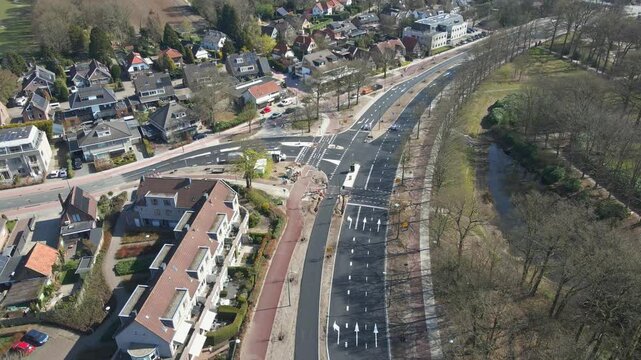 Aerial view of a new intersection in a small town - drone flying backwards
