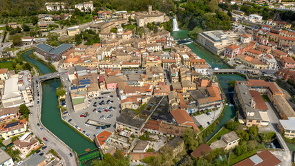 Fototapeta premium Aerial view of Isola del Liri, simply known as Isola Liri. It is an Italian city of Lazio, Italy, in the province of Frosinone. The old town is situated between two canals of the Liri river.