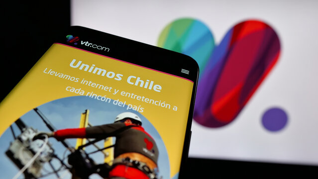 Stuttgart, Germany - 04-03-2025: Mobile phone with logo of Chilean company VTR Comunicaciones SpA on screen in front of website. Focus on top-left of phone display.