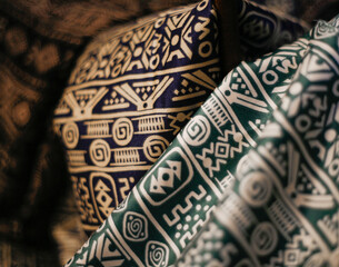 Close-up of colorful ethnic patterned fabrics, perfect for fashion or textile background themes with traditional cultural design.