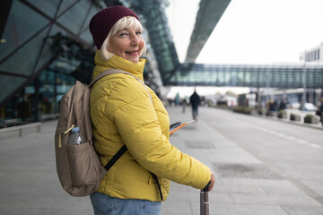 Fototapeta premium International airport terminal. Asian beautiful woman with luggage and walking in airport. High quality photo