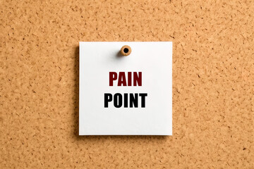 Pain point text on post-it paper pinned on the bulletin cork board