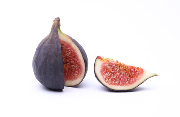 Cut ripe fig fruit isolated on white background