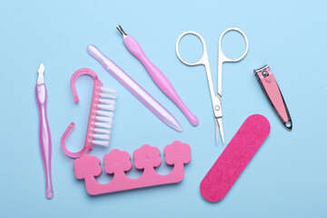 Nail care tools, manicure set on blue background. Flat lay. Top view