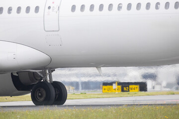 Airplane wheels turning on the runway during taxiing