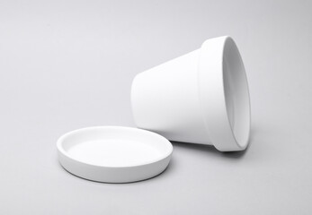 White empty clay flowerpot on gray background. Mockup for design