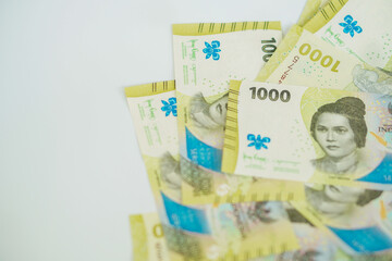 A stack of thousand rupiah banknotes with negative space, Indonesian money. suitable for background, finance, banking, cash, savings.