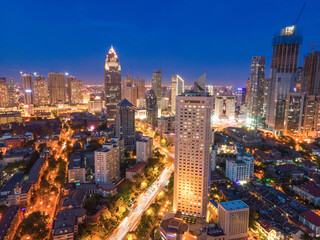 Stunning Night Cityscape View with Illuminated Skyscrapers and Urban Life