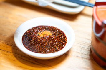 Spicy Sauce in a Bowl on Wooden Table