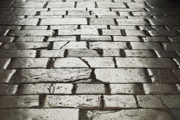detail of an old cobblestone street in Italy