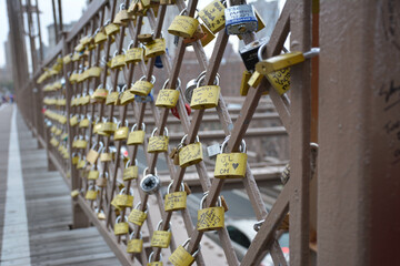 a lovely bridge with love locks affixed to its railing, each inscribed with names and phrases...