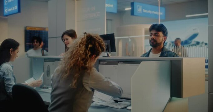 Multiethnic Passengers at Check-in Counter: Female Airline Agents Accepting Documents and Airplane Tickets, Checking Biometric Data on Computers. Passport Control in International Airport Terminal.