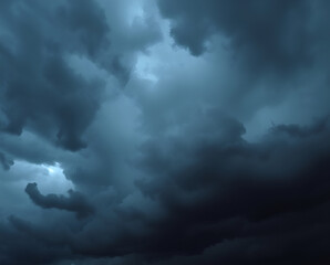Obraz premium Dark storm clouds gather ominously over the horizon as daylight fades into twilight