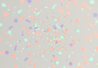 Pastel Confetti Scattered on Light Gray Background