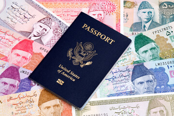 American passport on a Pakistani Rupee