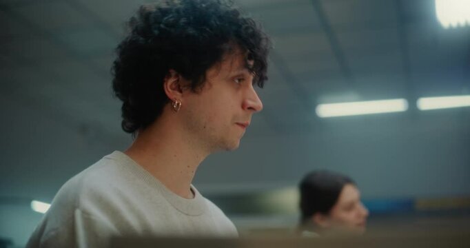 Diverse Passengers at Airport Check-in Counter: Close Up of Young Man Talking to Airline Agent During Passport Check for Boarding Flight. Customer Service or Security Checkpoint in Airport Terminal.