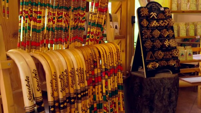 Various Decorative Walking Sticks and Folk Patterns in the Souvenir Shop. Souvenir, Memento or Keepsake is an Object a Person Acquires for the Memories the Owner Associates with it.
