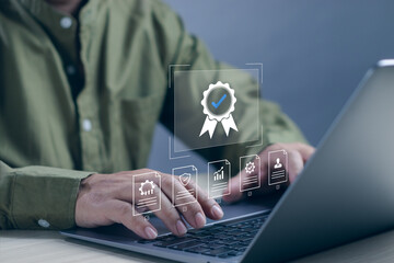 Quality assurance and quality control concept, businessman working with computer at desk showing...