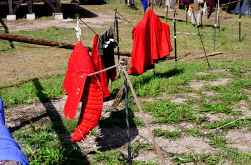 A close up on a set of leather clothes utilized to protect the knight and worn under the armor proper, seen on a medieval battlefield during a Polish history fair organized in summer