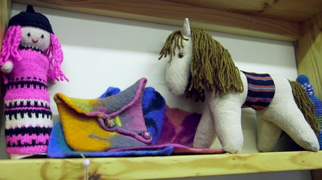 Knitted, Felted and Sewn Rag Dolls on a Shelf in a Children's Room or Shop. Felt, Particularly Made From Wool, is Considered to be the Oldest Known Man-made Textile in Sheep Herding Areas.