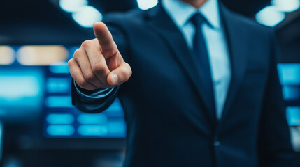 A businessman in a suit points confidently, conveying authority and making a decisive statement in a modern, blurred background.