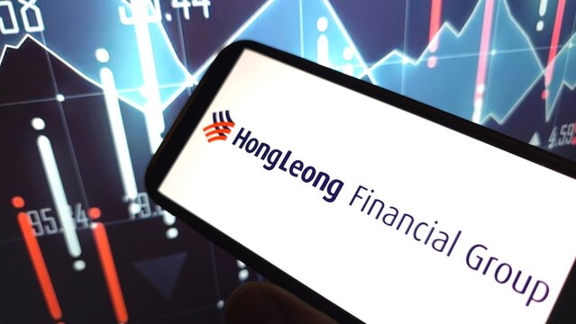 Konskie, Poland - April 06, 2025: Hong Leong Financial Group company logo displayed on mobile phone